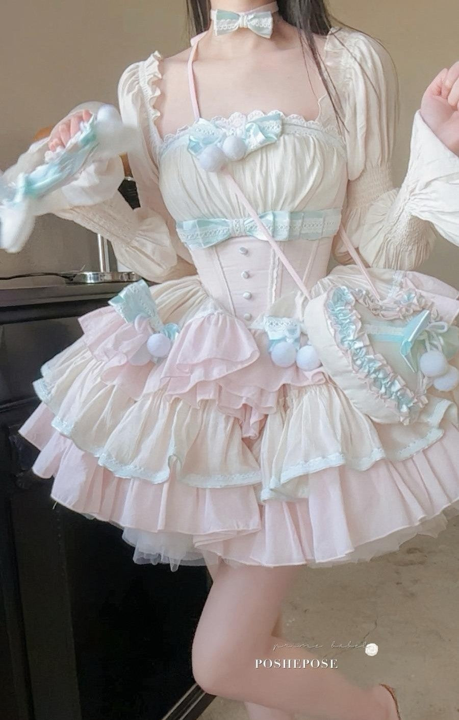 Elegant corset-style lolita dress in mint and cream with layered tulle and lace details.