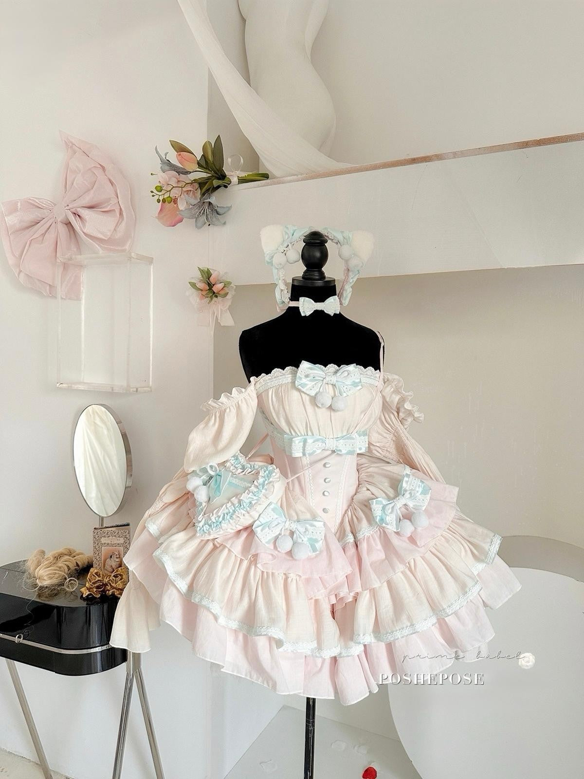 Poshepose Global mint lullababy wonderland dress with lace corset and puff sleeves.