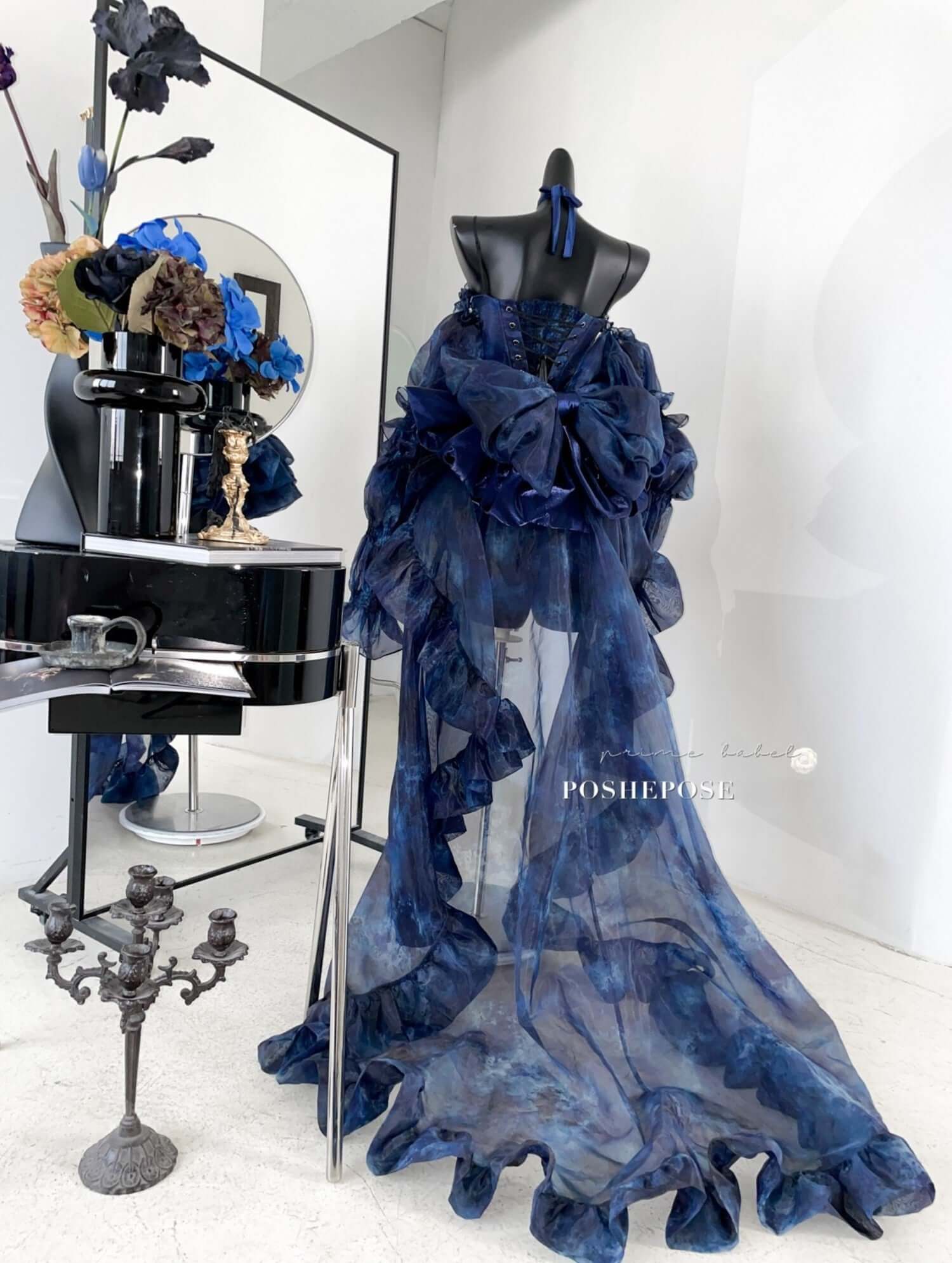 Haute Couture Deep Sea Dress Limited Edition displayed on mannequin with ruffles and elegant design in a chic setting.