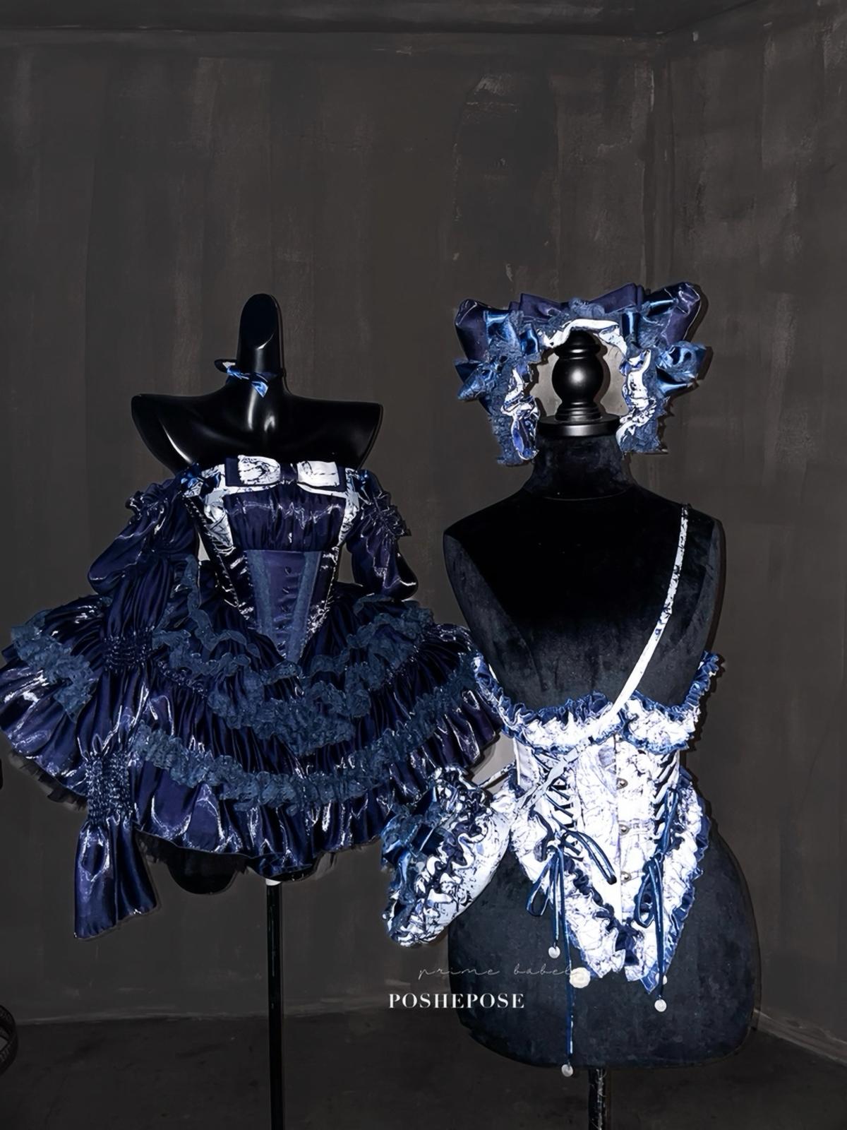 Romantic Rococo-inspired navy dress with puff sleeves and detailed lace.