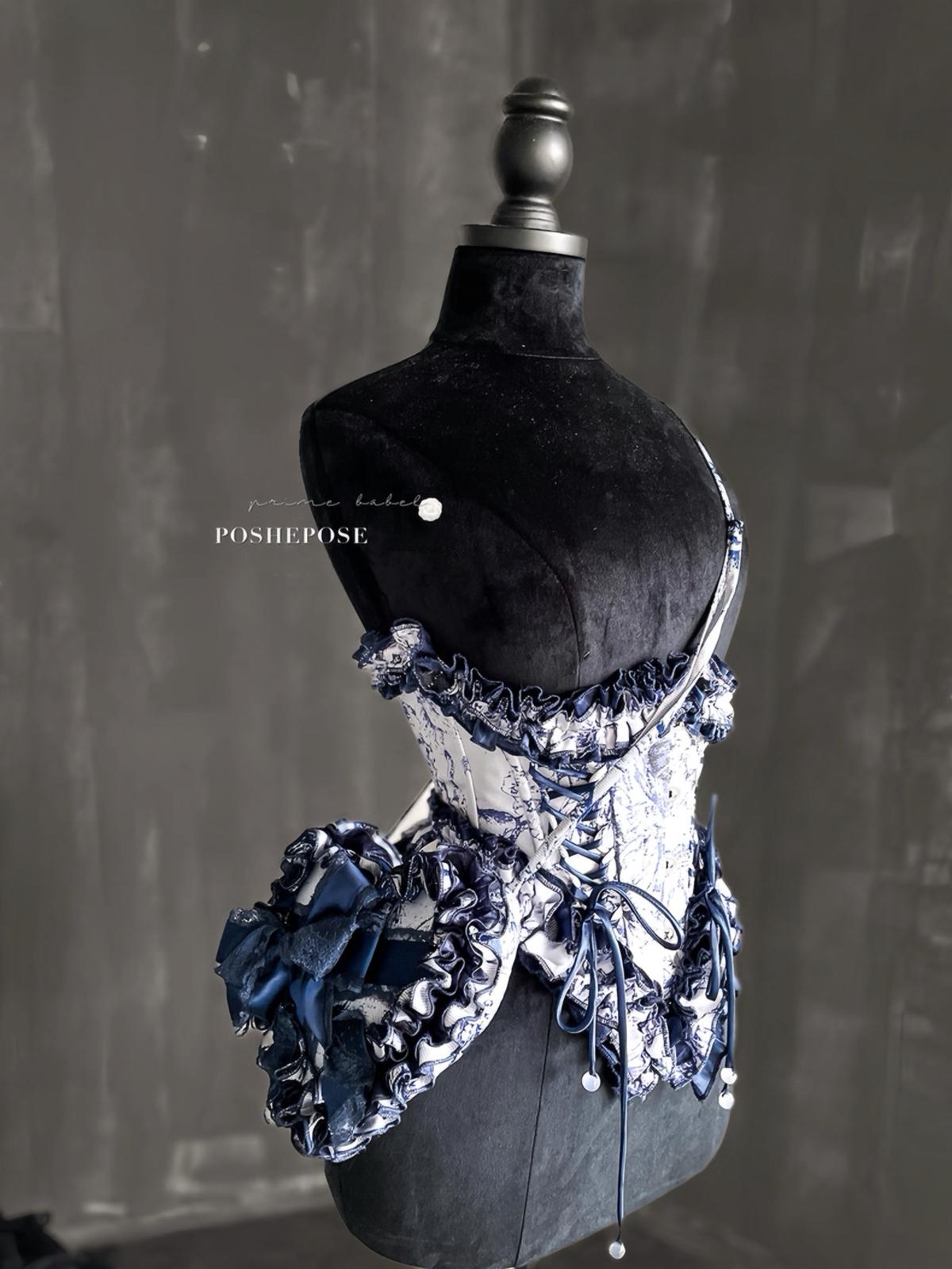 Vintage gothic lolita navy corset dress with layered lace and satin bows.