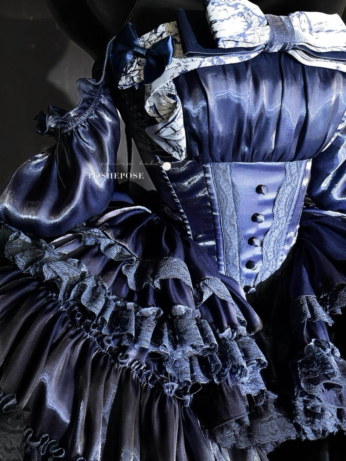Gothic aristocrat-style lolita dress with ruffles, bows, and navy tones.