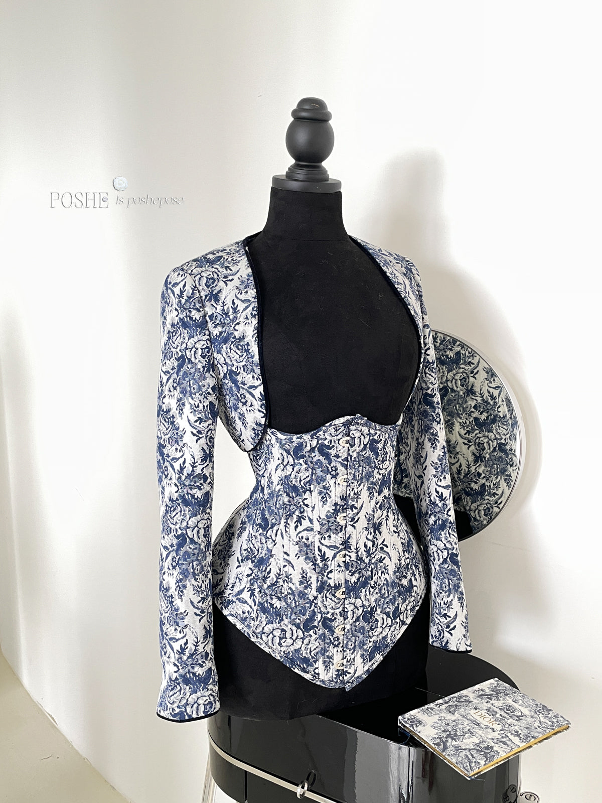 Baroque-inspired corset top in Caviar Blue floral jacquard and white satin ruffles.