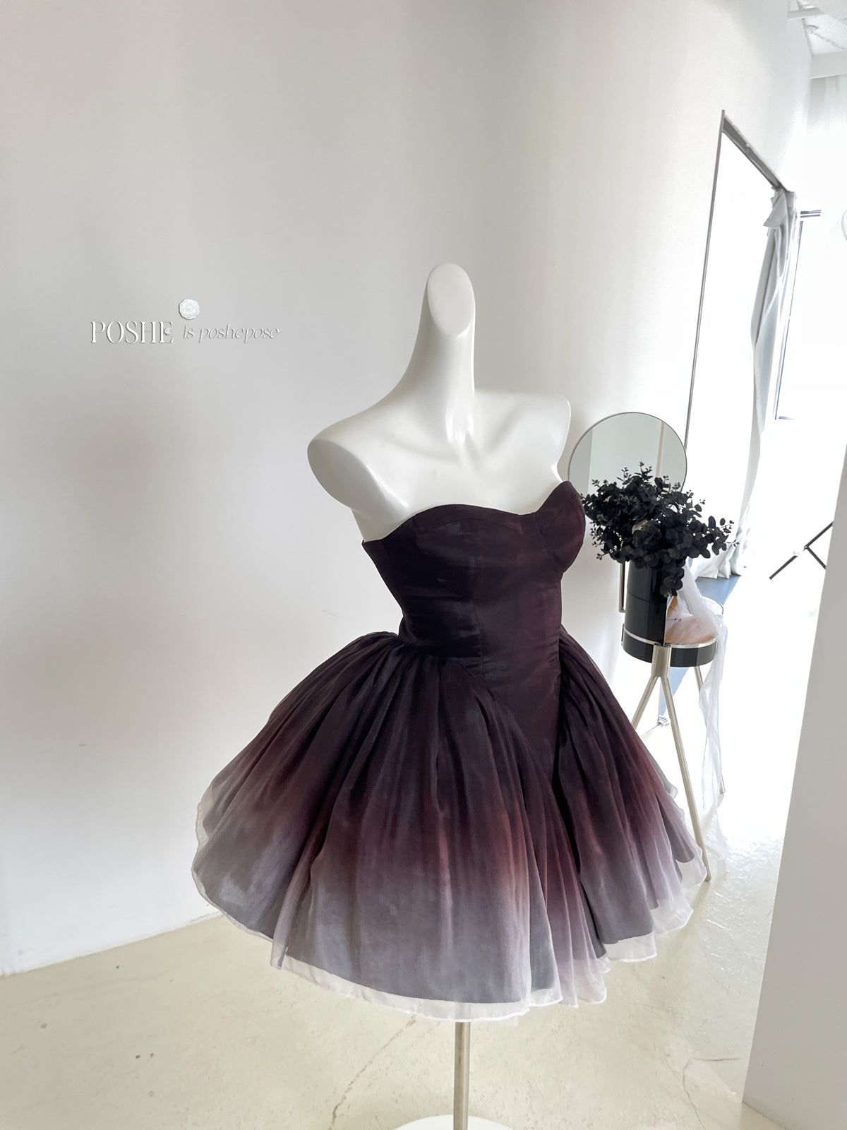 Designer Black Swan dress with dramatic tutu-style silhouette.