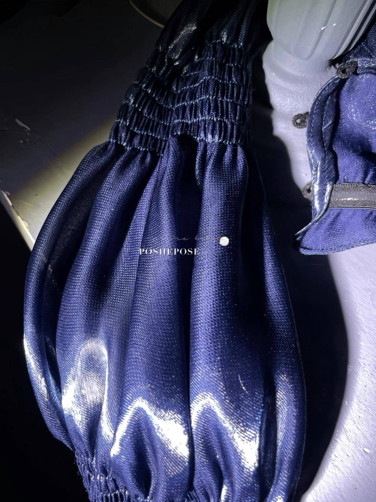 Gothic couture navy dress with structured silhouette and ornate lace trim.