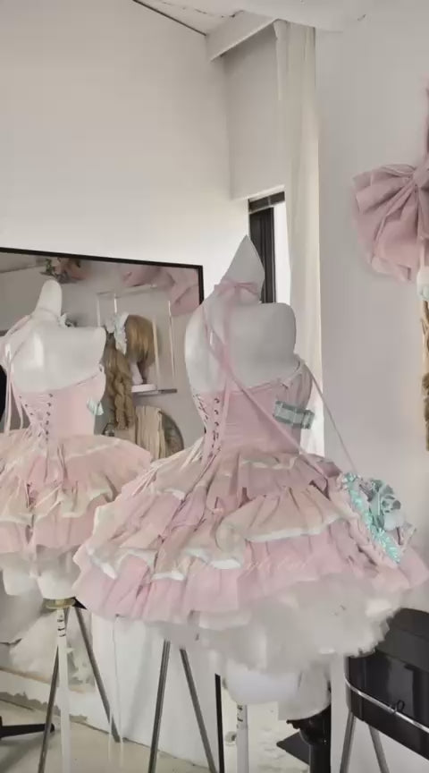 Pastel pink and mint lolita dress with corset bodice and ruffled skirt by Poshepose Global.