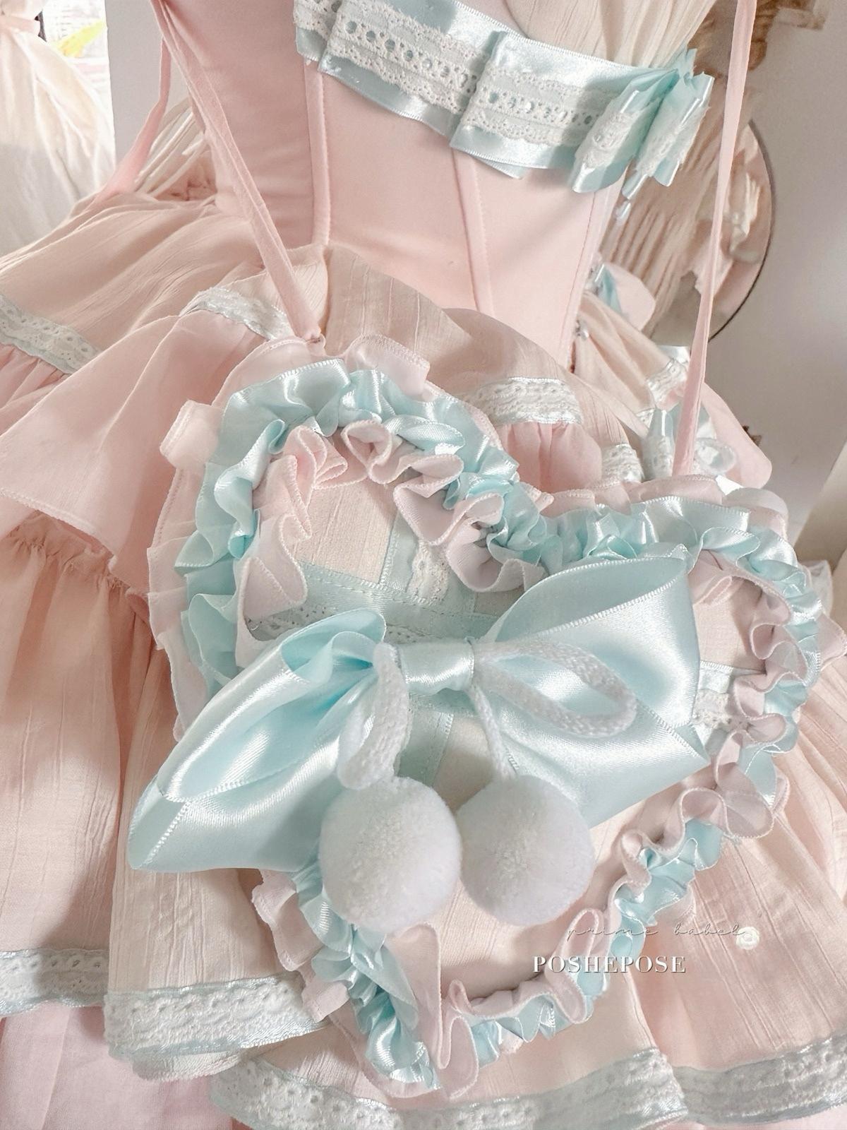 Dreamy pastel mint and blush lolita outfit inspired by fairy-tale wonderland fashion.